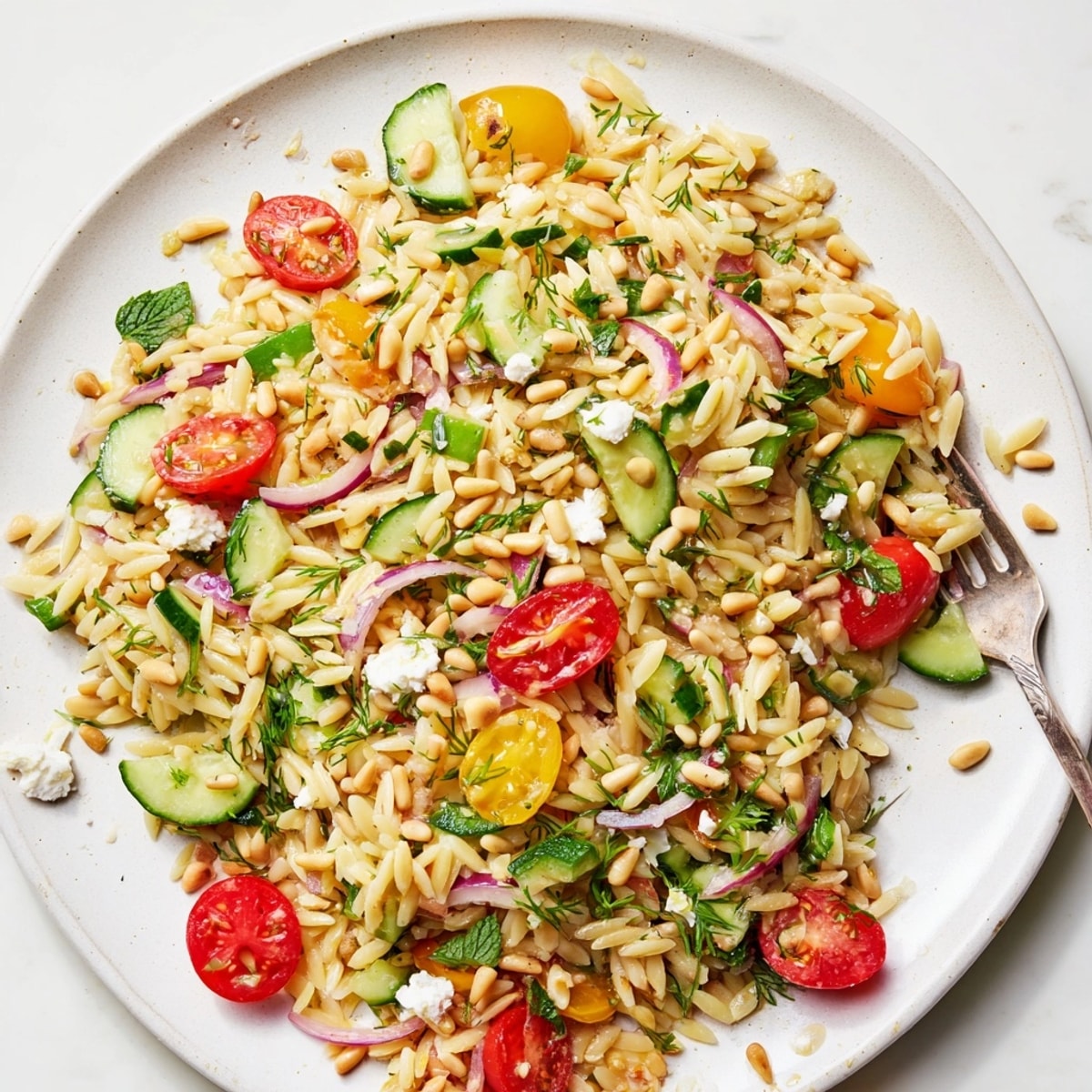 Zesty Lemon Herb Orzo Salad recipe: a fresh, Mediterranean-inspired side or light meal.