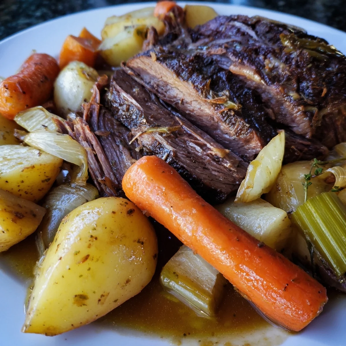 Richly flavored Sunday pot roast, surrounded by fragrant, caramelized roasted vegetables.  