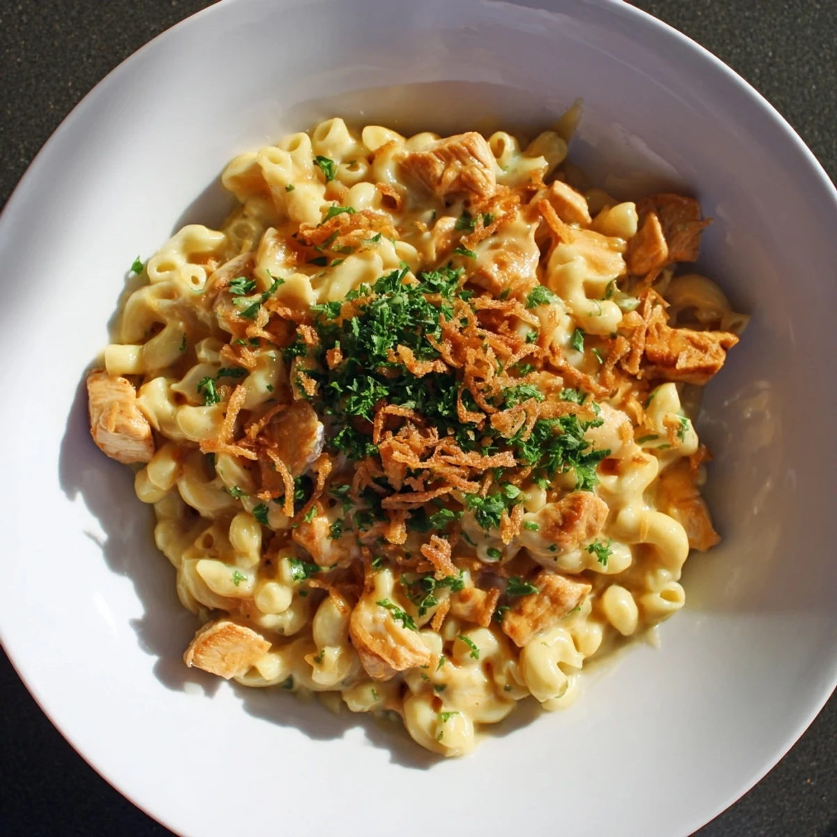 This comforting One-Pot Honey BBQ Chicken Mac and Cheese features tender chicken, smoky BBQ sauce, and melty cheese.
