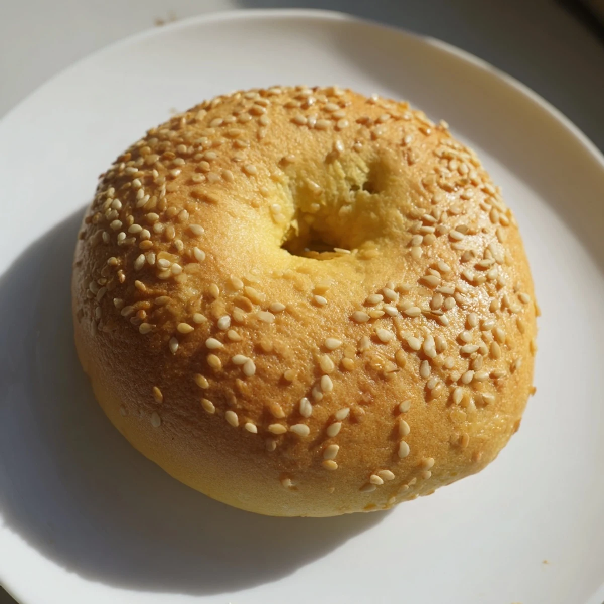 Close-up of fluffy Homemade Budget Bagels, sliced open, inviting flavors with their dense, chewy texture.