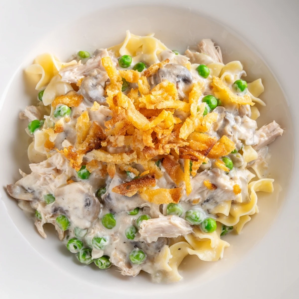 This warm photo showcases a bubbling Creamy Tuna Noodle Casserole, perfect for a cozy dinner.