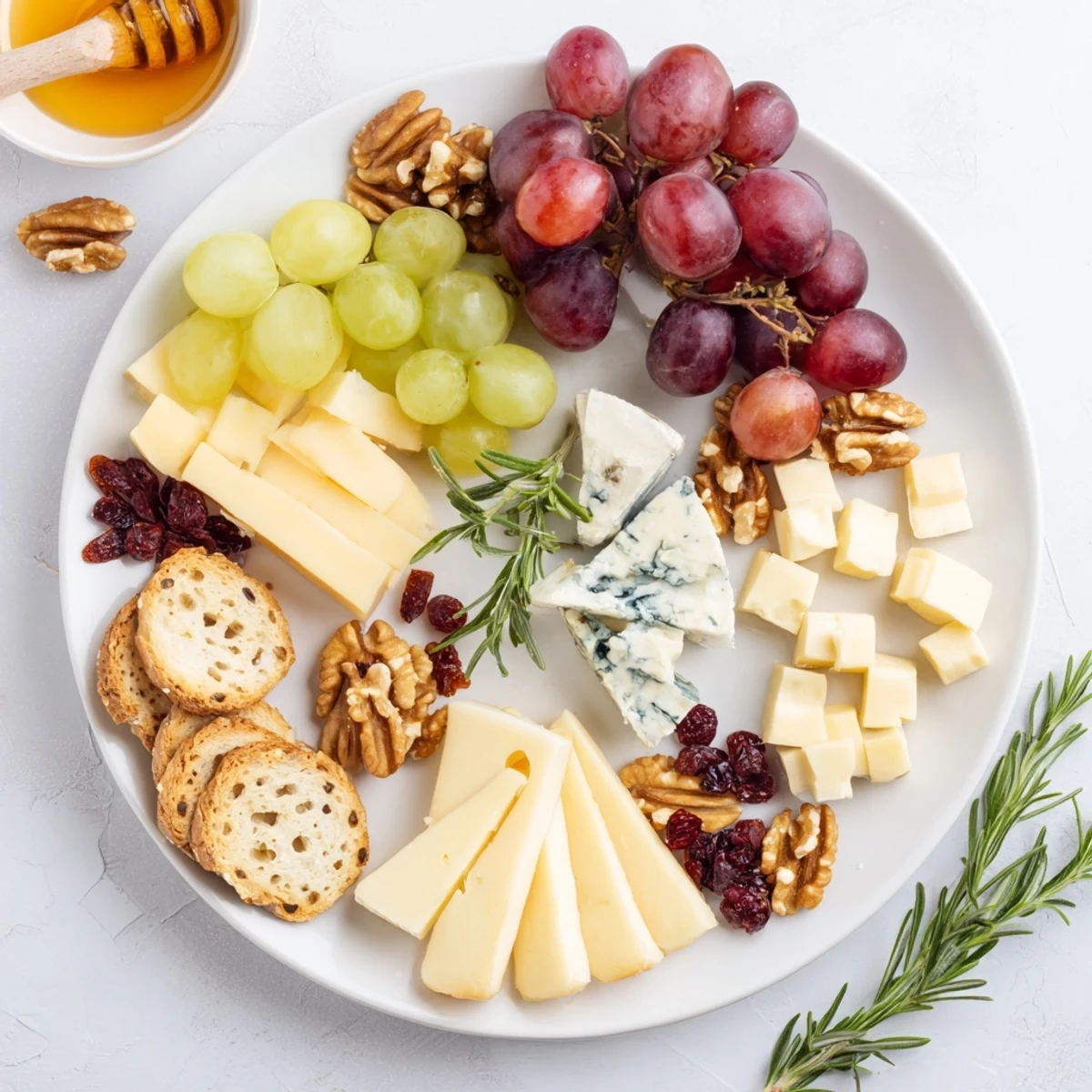 Cheese & Fruit Cranberry Grape Man Cheese Board arranged with tempting cheeses, grapes, and crackers.