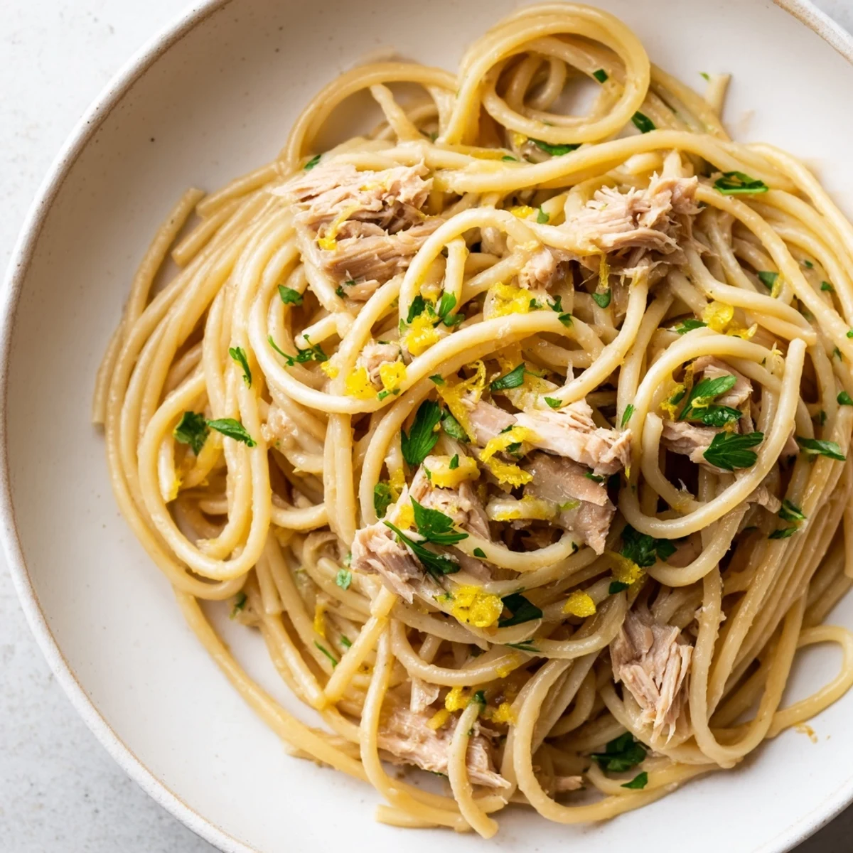 Flaky tuna and vibrant lemon flavors shine in this delicious Lemon-Garlic Tuna Spaghetti.