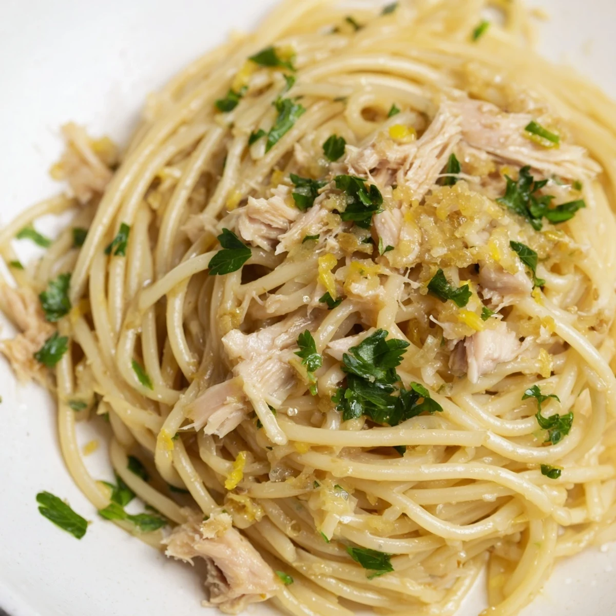 Close-up of golden spaghetti with lemon and tuna; perfect Lemon-Garlic Tuna Spaghetti.