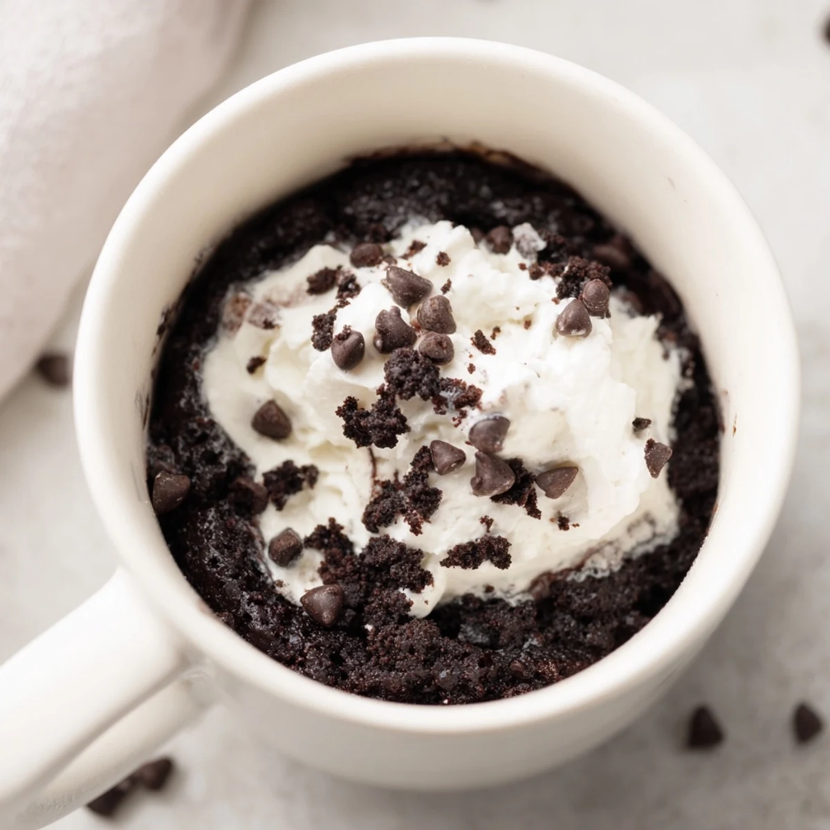 Chocolatey Oreo mug cake, individually portioned, ready and perfect for a sweet, simple treat.