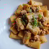A close-up view of the spicy and creamy Chaos Cooking Kimchi Ragu Pasta, ready to be enjoyed.