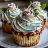 Baby in Bloom Floral Cupcakes with Pastel Buttercream: A dozen soft vanilla cupcakes adorned with delicate, hand-piped buttercream flowers in soft pink, yellow, and lavender.