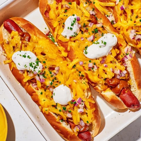 This savory Chili Dog Casserole features bubbling cheese and tender hot dogs, perfect for family dinners.