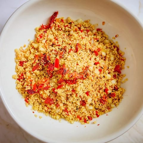 This close-up showcases Volcanic Lava Spicy Dip, with roasted peppers and a swirl of creamy yogurt.