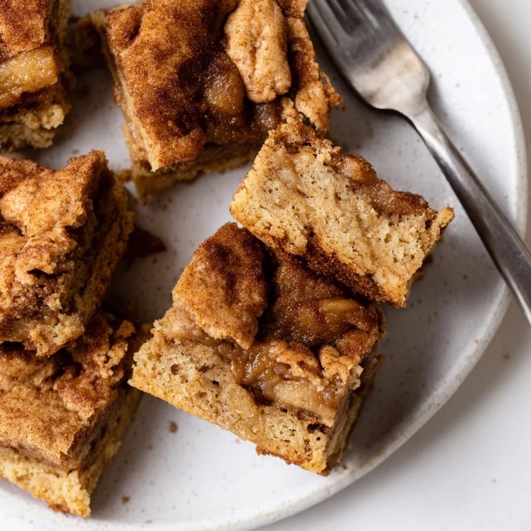 Indulgent blondies featuring apple butter and a crisp cinnamon sugar crust, perfect for dessert.