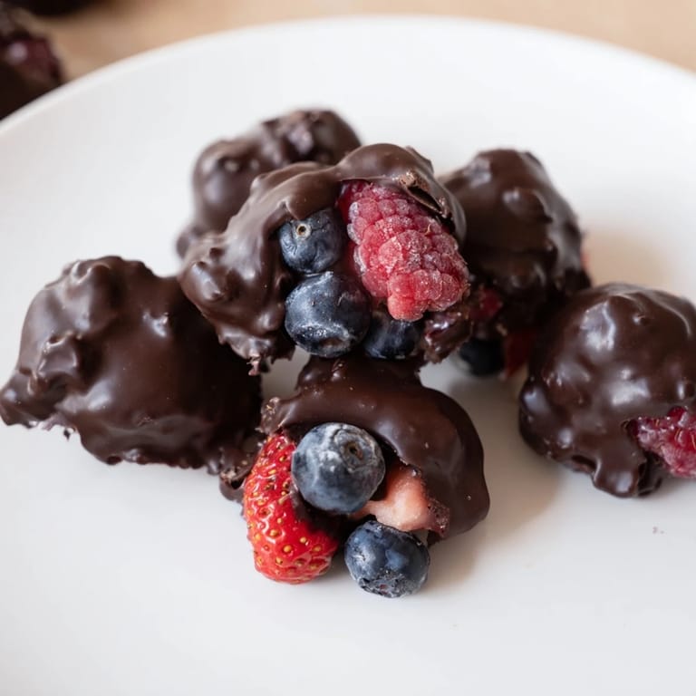 Indulge in these delicious Chocolate Yogurt Clusters; creamy yogurt and berries coated in chocolate.