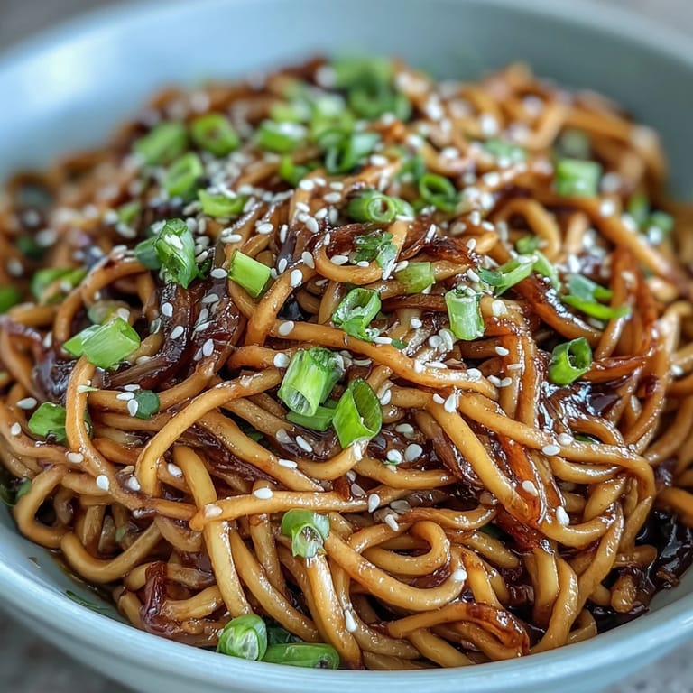 Savory Asian Ginger Scallion Noodles with Soy Glaze - Aromatic ginger and garlic infuse these noodles, coated in a balanced soy glaze, perfect for weeknight dinners.