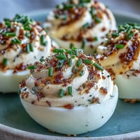 Everything Bagel Deviled Eggs topped with savory seasoning, a brunch favorite.
